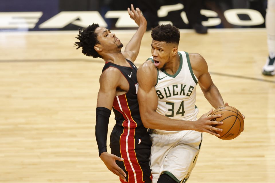 Miami, Florida - December 29: Giannis Antetokounmo # 34 of the Milwaukee Bucks lead against KZ Okpala # 4 of the Miami Heat during the third quarter at the American Airlines Arena on December 29, 2020 in Miami, Florida.  Note to the user: The user expressly acknowledges and agrees, by downloading or using this image, that the user accepts the terms and conditions of the Getty Images License Agreement.  (Photo by Michael Reeves / Getty Images)