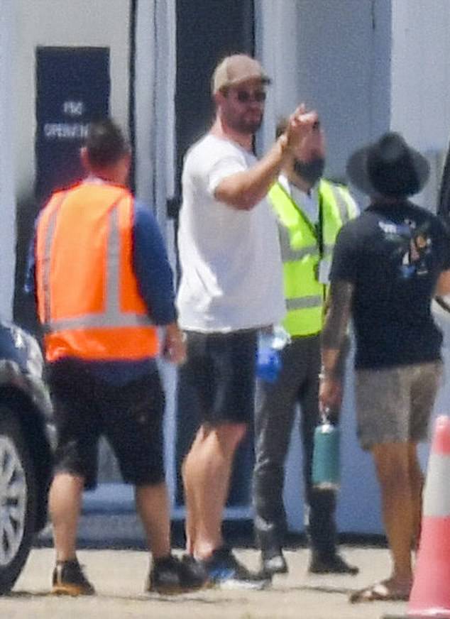 Casual look: The Marvel star covered his famous hulking body by wearing only a casual white T-shirt and a pair of black pants